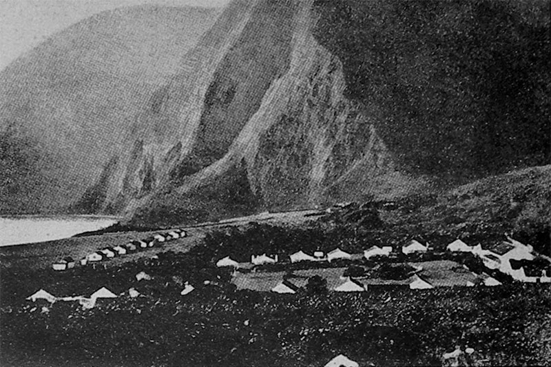 The steep cliffs overlooking the settlement
