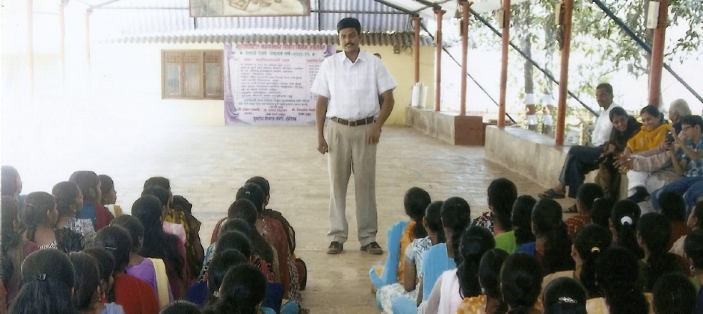 Standing tall: Nilkanth Koli addresses youth camp participants at Shantivan.