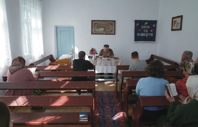 Romica takes the service on a recent Sunday in May.