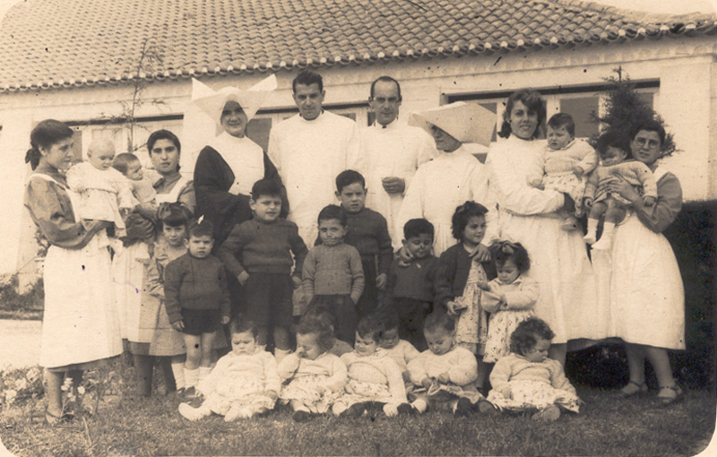 Children in the playground at Rovisco PaisWomen working in groups at Rovisco PaisWorking group of women sewingMen working in the fields with livestock, probably in the late 1940s or early 1950sMen working in the fields, close to the administration building, which can be seen behind the wall. The sisters also lived here, on the top floor; their living space was called the ‘little convent’.Working in the fields near the administration buildingWomen working in the fields, with men behind in a second line